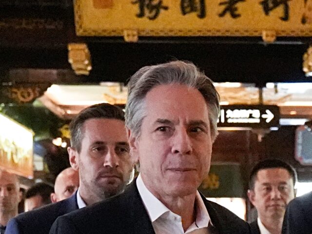 US Secretary of State Antony Blinken (L) and US Ambassador to China Nicholas Burns walk th