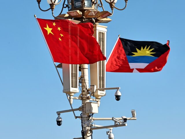 BEIJING, CHINA - JANUARY 22: The national flags of Antigua and Barbuda and China flutter a