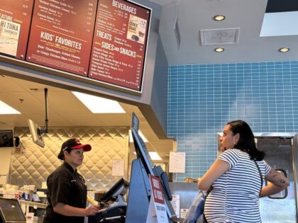 A customer places in order at The Habit Burger Grill on April 11, 2024, in San Rafael, Cal