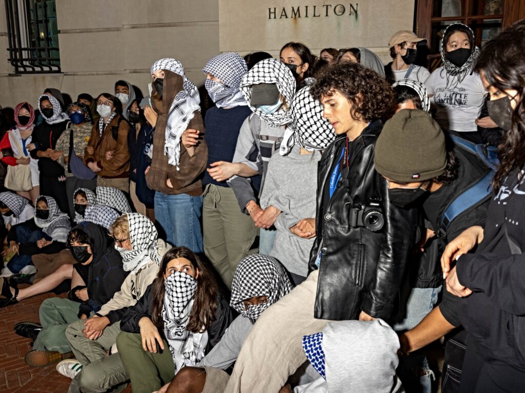NEW YORK, NEW YORK - APRIL 29: Students/demonstrators lock arms to guard potential authorities against reaching fellow protestors who barricaded themselves inside Hamilton Hall, an academic building which has been occupied in past student movements,, and name it after a Palestinian child allegedly killed by the Israeli military on Tuesday, April 30, 2024 in New York City. Pro-Palestinian demonstrators marched around the 