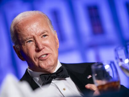 US President Joe Biden looks on during the White House Correspondents' Association (WHCA)