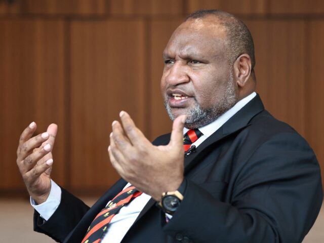 Papua New Guinea’s Prime Minister James Marape reacts as he speaks during an interview i