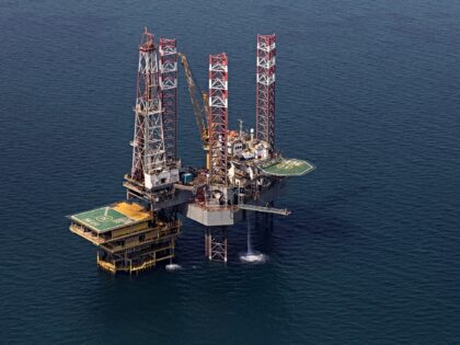An offshore drilling platform stands in shallow waters at the Manifa offshore oilfield, op
