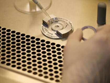 A laboratory technician deposit sperm in order to carry out a spermogram at the Centre for