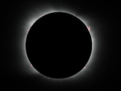 The moon covers the sun during a solar eclipse in Piedra del Aguila, Argentina, Monday, De