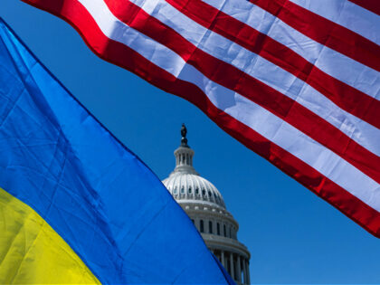 The U.S. Capitol dome is seen through American and Ukrainian flags on the East Plaza of th