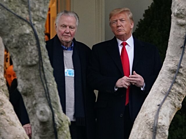 US President Donald Trump (R) stands with actor Jon Voight outside the Oval Office before