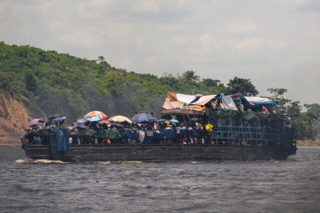 All aboard! A wooden whaler passes by on the Congo River, near the capital Kinshasa
