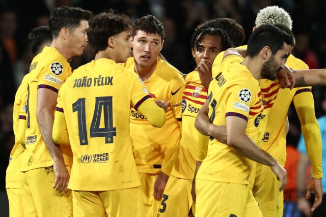 Barcelona players celebrate after Andreas Christensen (C) put them 3-2 up against PSG in t