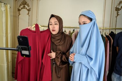Chinese students at an e-commerce school rehearse selling hijabs and abayas into a smartph
