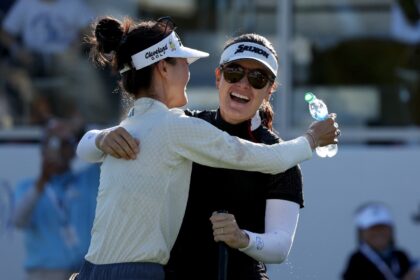 Hannah Green celebrates with fellow Australian Grace Kim after winning the LPGA's LA Champ
