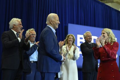 Kerry Kennedy (R) introduces US President Joe Biden (3rd L) during a campaign event where