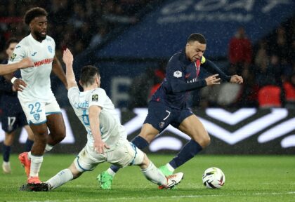 Kylian Mbappe (R) in action for Paris Saint-Germain against Le Havre on Saturday