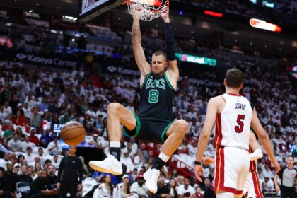 Latvian Kristaps Porzingis of the Boston Celtics, dunking in a game-three NBA playoff vict