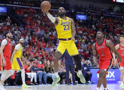 LeBron James of the Los Angeles Lakers shoots as Zion Williamson defends in the Lakers' NB