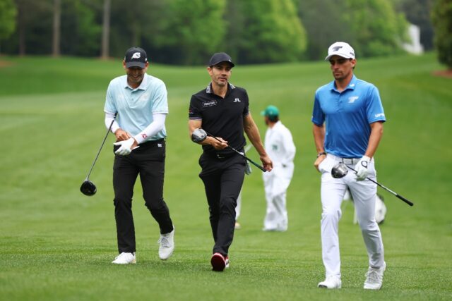 LIV Golf's Sergio Garcia of Spain, left, and Joaquin Niemann of Chile, right, walk alongsi