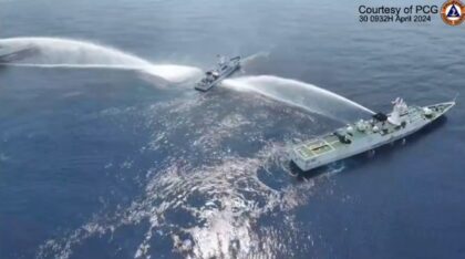 The Philippine Coast Guard says the China Coast Guard used water cannon against one of its