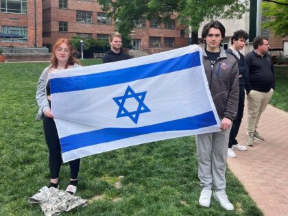 Philosophy student Skyler Sieradzky, 21, left, holds an Israeli flag as pro-Palestinian pr