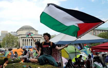 Protestors wave Palestinian flags on the West Lawn of Columbia University on April 29, 202