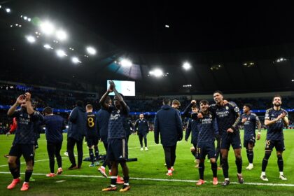 Real Madrid players celebrate at the end of the Champions League quarter-final second-leg
