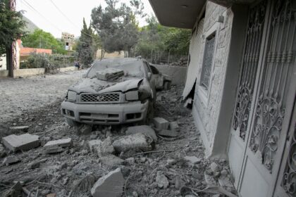 Rubble litters the area around a house hit by an Israeli air strike in the southern Lebane