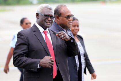 Solomon Islands' PM Manasseh Sogavare (L) says he will not stand for a new term