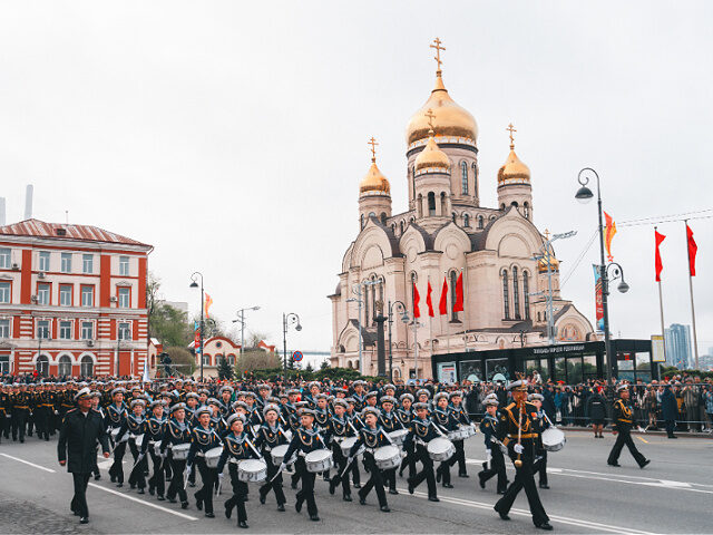 MAY 09: Russian servicemen march in formation during a Victory Day military parade marking
