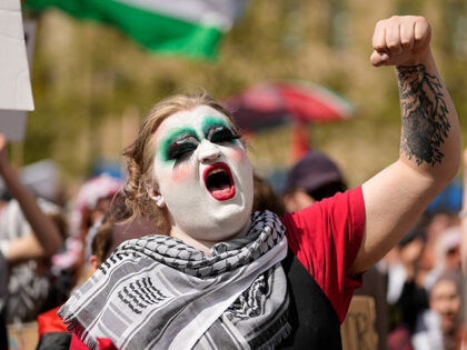 A pro-Palestinian demonstrator protests against the participation of Israeli contestant Ed