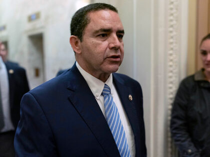 Rep. Henry Cuellar, D-Texas, walks to the House chamber to vote on Capitol Hill, Wednesday