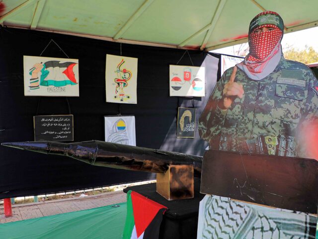 A cutout depicting Abu Obeida, the masked spokesman of the Qassam Brigades (the armed wing