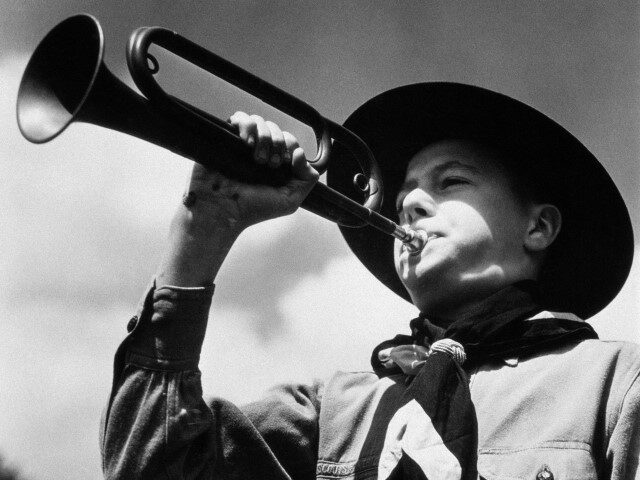 Boy Scout blowing trumpet, 1950s