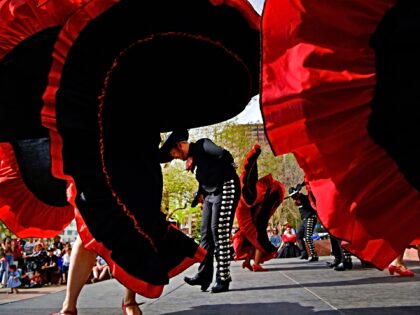 DENVER, CO - MAY 8: Dancers with Ballet Folklorico Baile Caliente perform on the Fiesta Fo