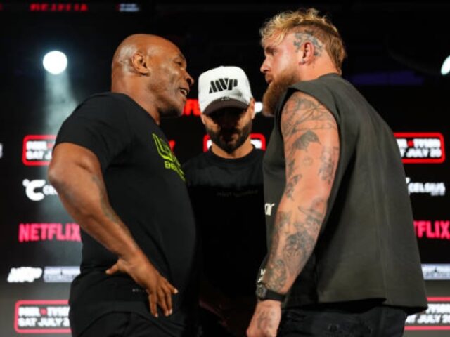 ARLINGTON, TEXAS - MAY 16: (L-R) Mike Tyson, Nakisa Bidarian and Jake Paul pose onstage du