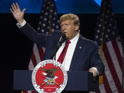Former President Donald Trump gestures as he speaks during the National Rifle Association