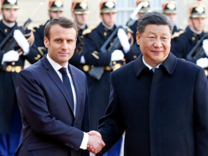 PARIS, FRANCE - MARCH 25: French President Emmanuel Macron welcomes Chinese President Xi J