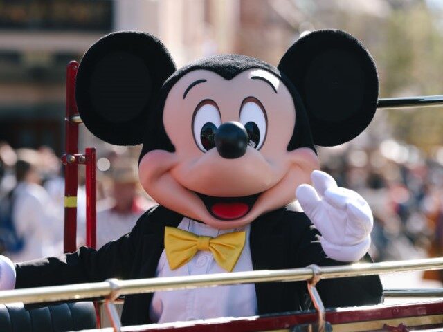 Mickey Mouse participates in a parade during a 100 year celebrations focusing on the Walt