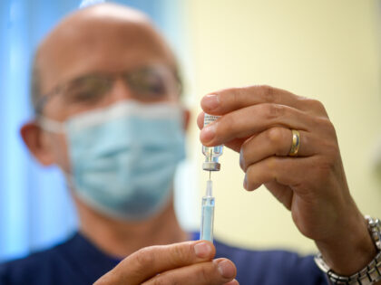 BRIDPORT, ENGLAND - MARCH 20: Vaccinators administer the Oxford AstraZeneca COVID-19 Vacci