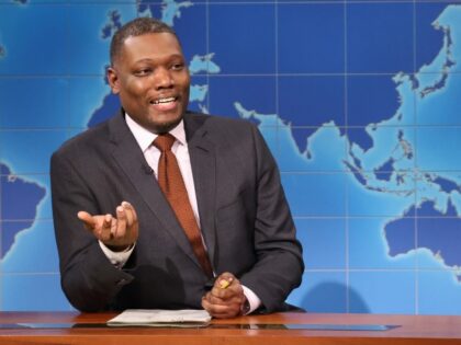 SATURDAY NIGHT LIVE -- Episode 1861 -- Pictured: (l-r) Anchor Michael Che and surprise gue