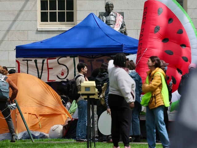Cambridge, MA - April 24: Protesters occupied the space in front of the statue of John Har
