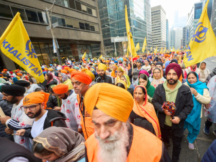 Sikhs march in a parade to mark Khalsa Day celebrations in Toronto, Ontario, Canada on Apr