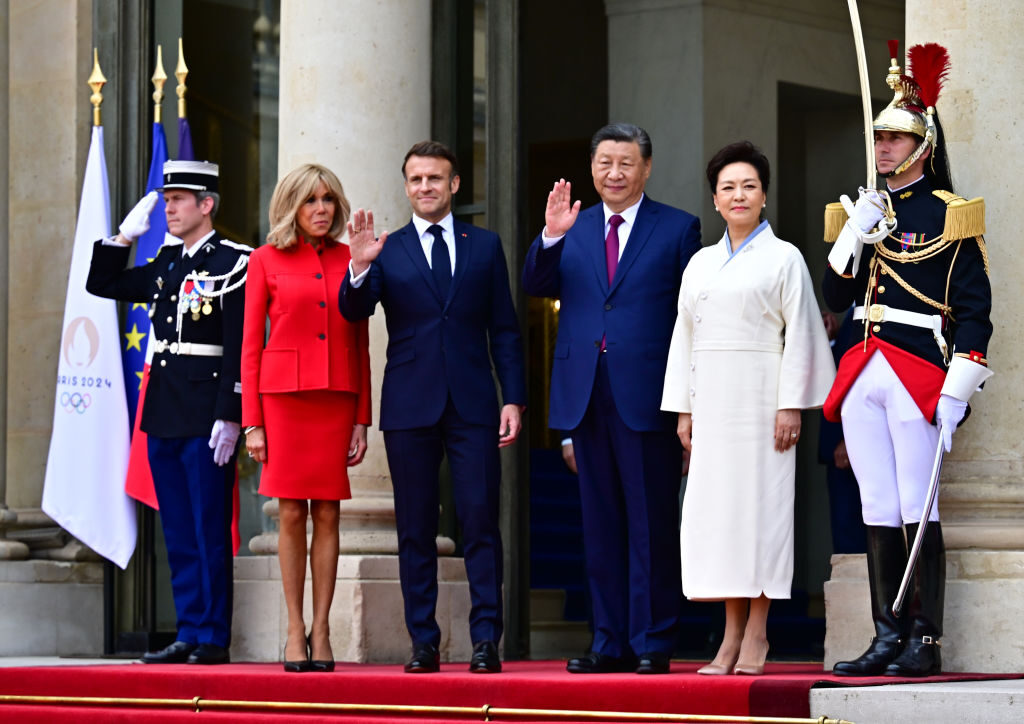 PARIS, FRANCE - MAY 6: France's President Emmanuel Macron and his wife Brigitte Macron welcome the Chinese President Xi Jinping and his wife Peng Liyuan, as part of the Chinese president's two-day state visit, at The Elysee Presidential Palace in Paris, on May 6, 2024. French President Emmanuel Macron is to host Xi Jinping for a state visit on May 6, 2024, seeking to persuade the Chinese leader to shift positions over Russia's invasion of Ukraine and also imbalances in global trade. Xi's first visit to Europe since 2019 will also see him hold talks in Serbia and Hungary. Xi has said he wants to find peace in Ukraine even if analysts do not expect major changes in Chinese policy. (Photo by Christian Liewig - Corbis/Corbis via Getty Images)