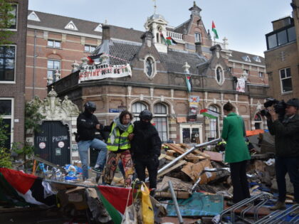 AMSTERDAM, NETHERLANDS - MAY 08: Police forcefully intervene, arrest dozens and assaulting