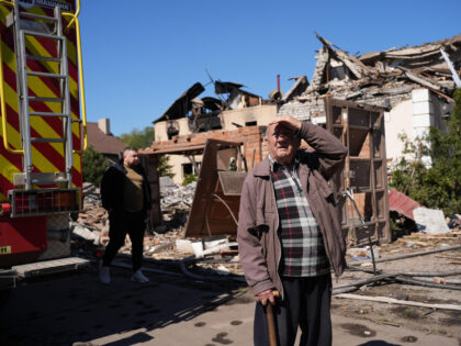 KHARKIV, UKRAINE – MAY 10: An elderly man stands near the site of a Russian missile stri