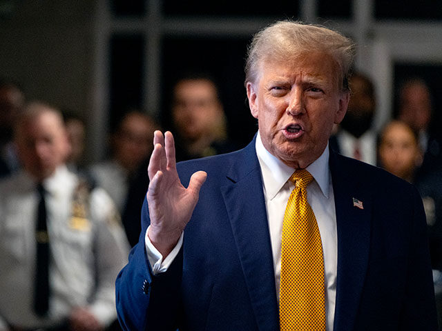 Former US President Donald Trump speaks to the media as he arrives for his trial for alleg