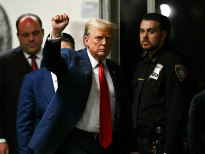 Former U.S. President Donald Trump returns to court during his trial for allegedly coverin