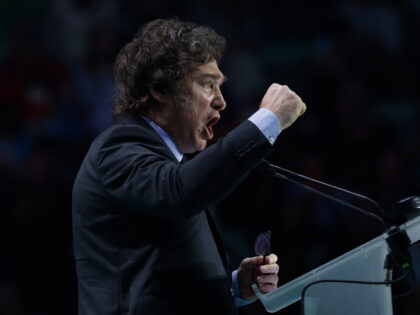 Argentina's president Javier Milei gestures as he delivers a speech on stage during the Sp