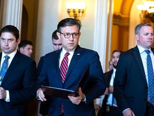 Speaker of the House Mike Johnson, R-La., makes his way to a news conference on the House