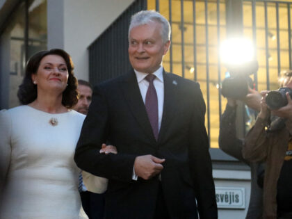 Lithuania's President Gitanas Nauseda and his wife Diana Nausediene arrive to wait fo