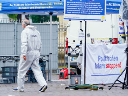 31 May 2024, Baden-Württemberg, Mannheim: A forensics officer walks past a stall on the m