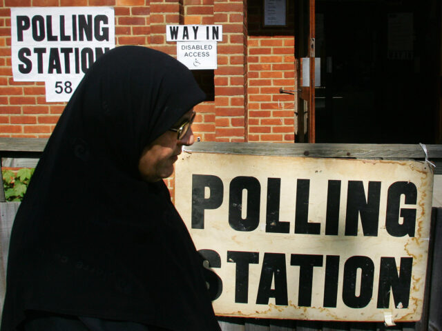 LONDON, UNITED KINGDOM: A Muslim woman leaves a polling station after casting her vote in